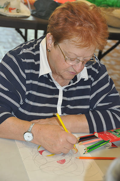 Rose Centers participant drawing a colored pencil sketch