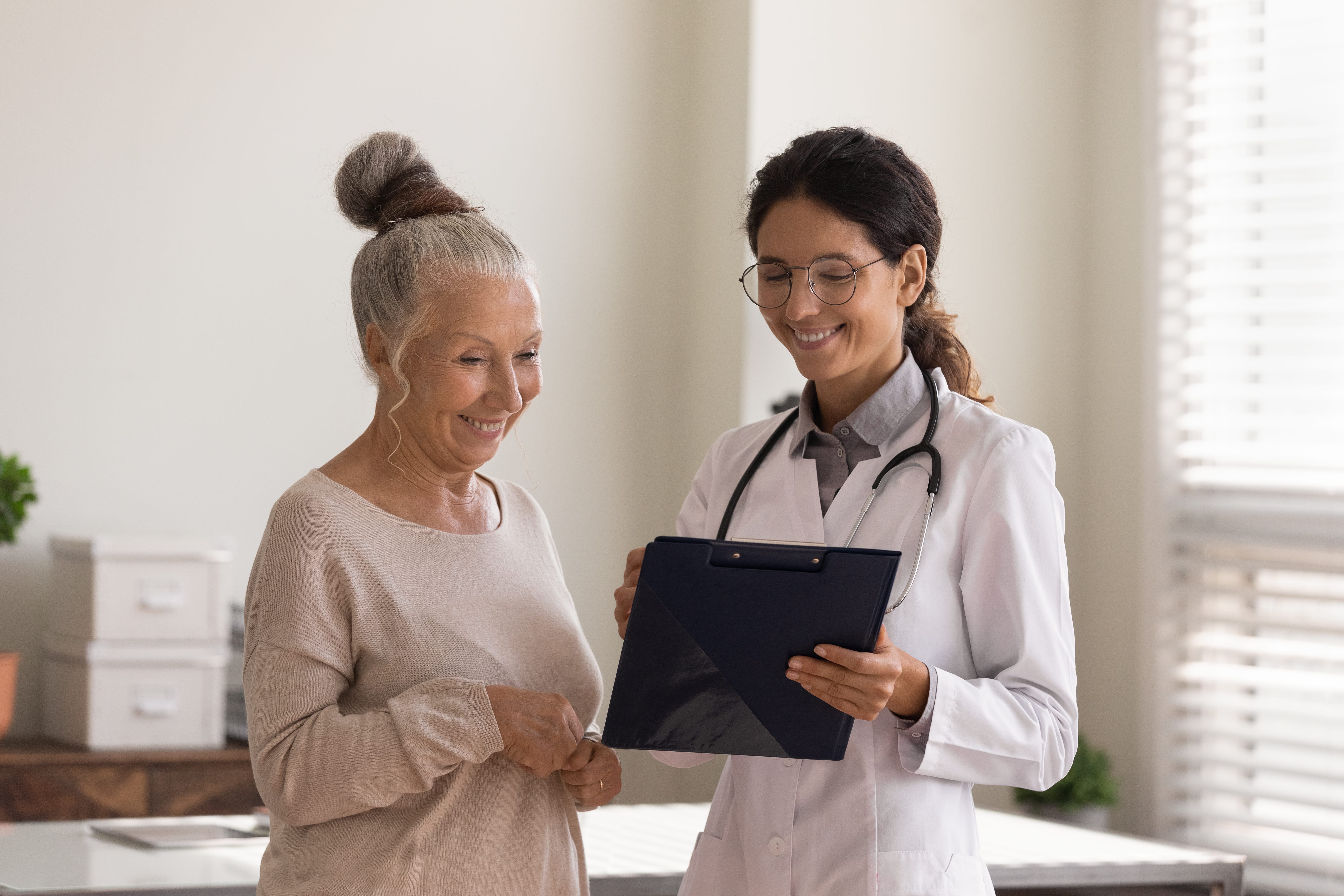 A caregiver consulting with a health care professional