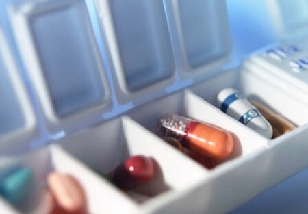 A prescription inside a pill container