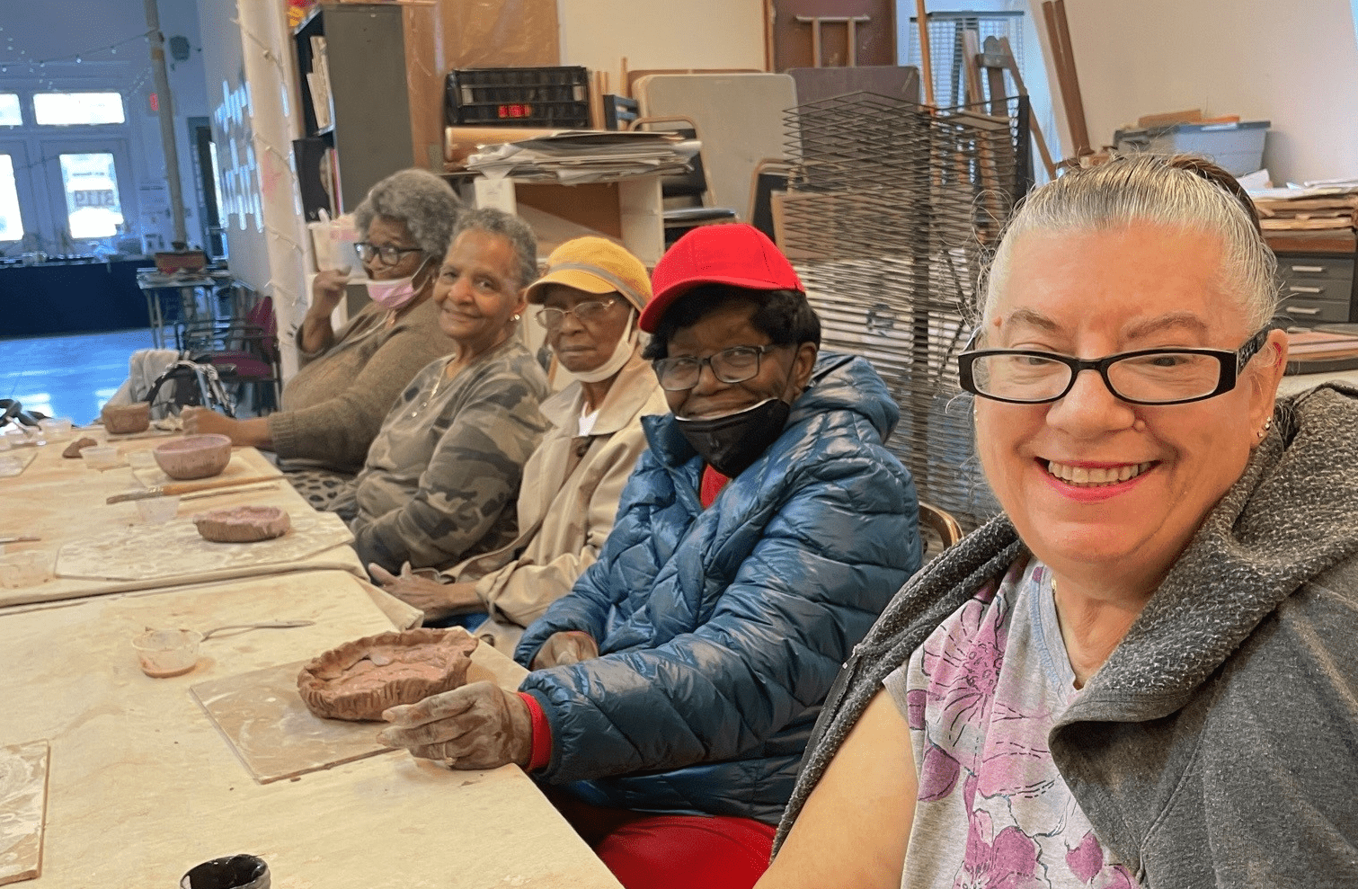 Five seniors participating in ceramics class at the Rose Centers for Aging Well
