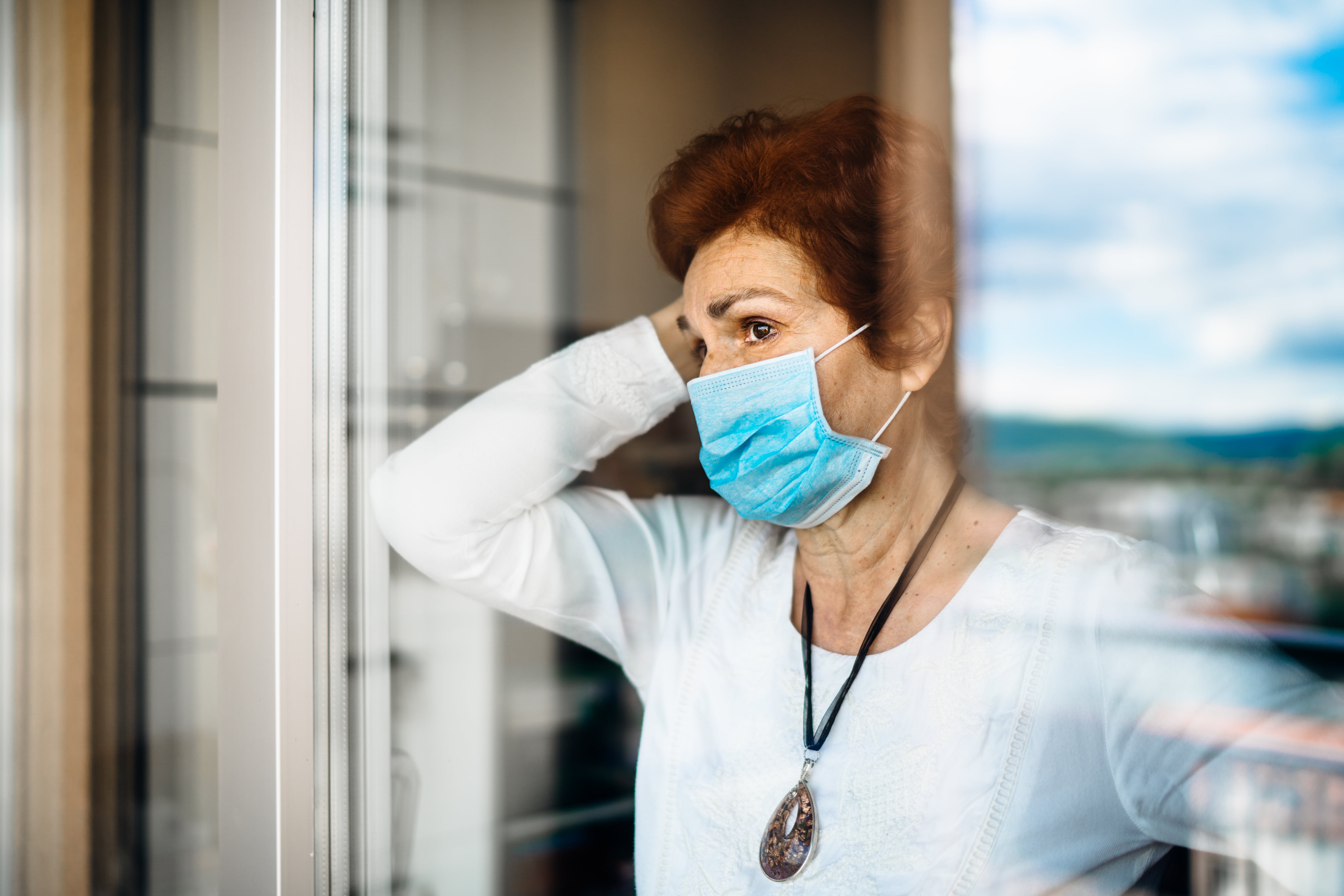 A caregiver wearing a protective face mask