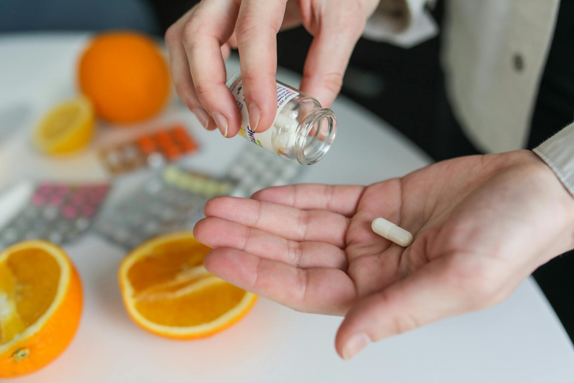 A person holding medication in their hand